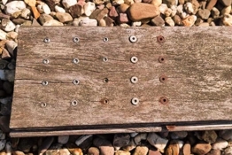 Sistema de Revestimientos para Tornillos de Construcción con Madera Sistema de Revestimientos para Tornillos de Construcción con Madera